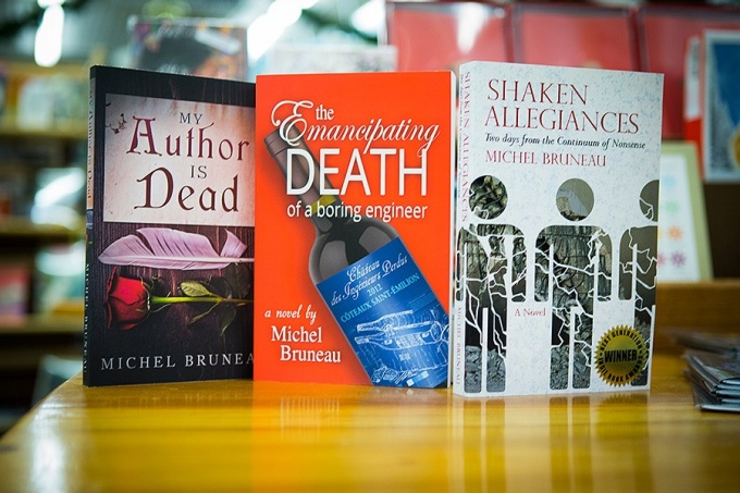 The three novels by Michel Bruneau displayed in a bookstore